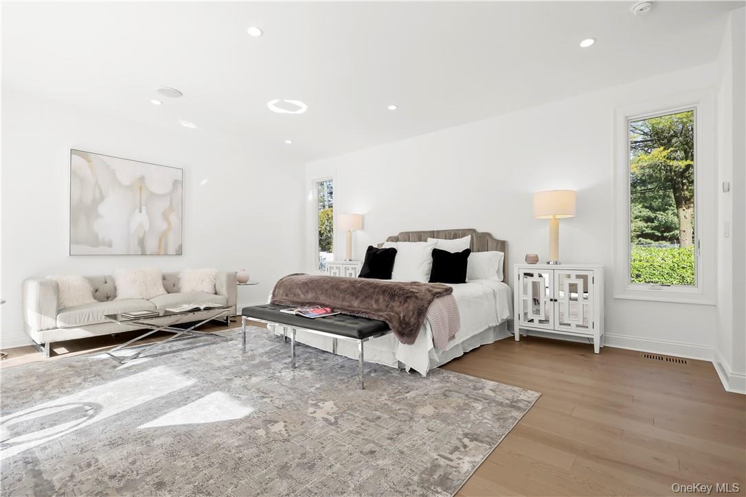 343 Purchase Street Rye, NY 10580 - Photo 23 of 36 a bedroom with a bed and wooden floor