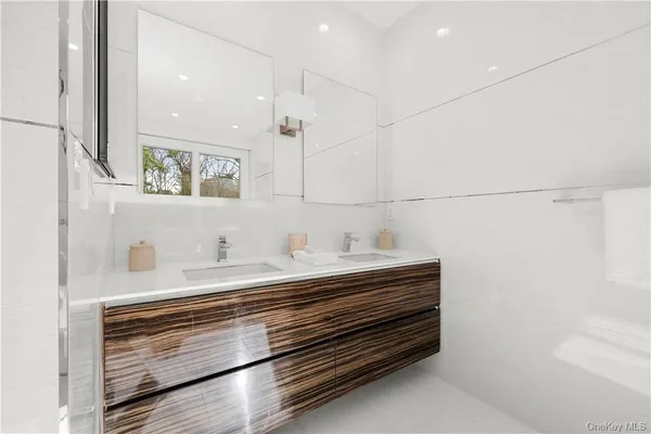 a white bath tub sitting next to a shower