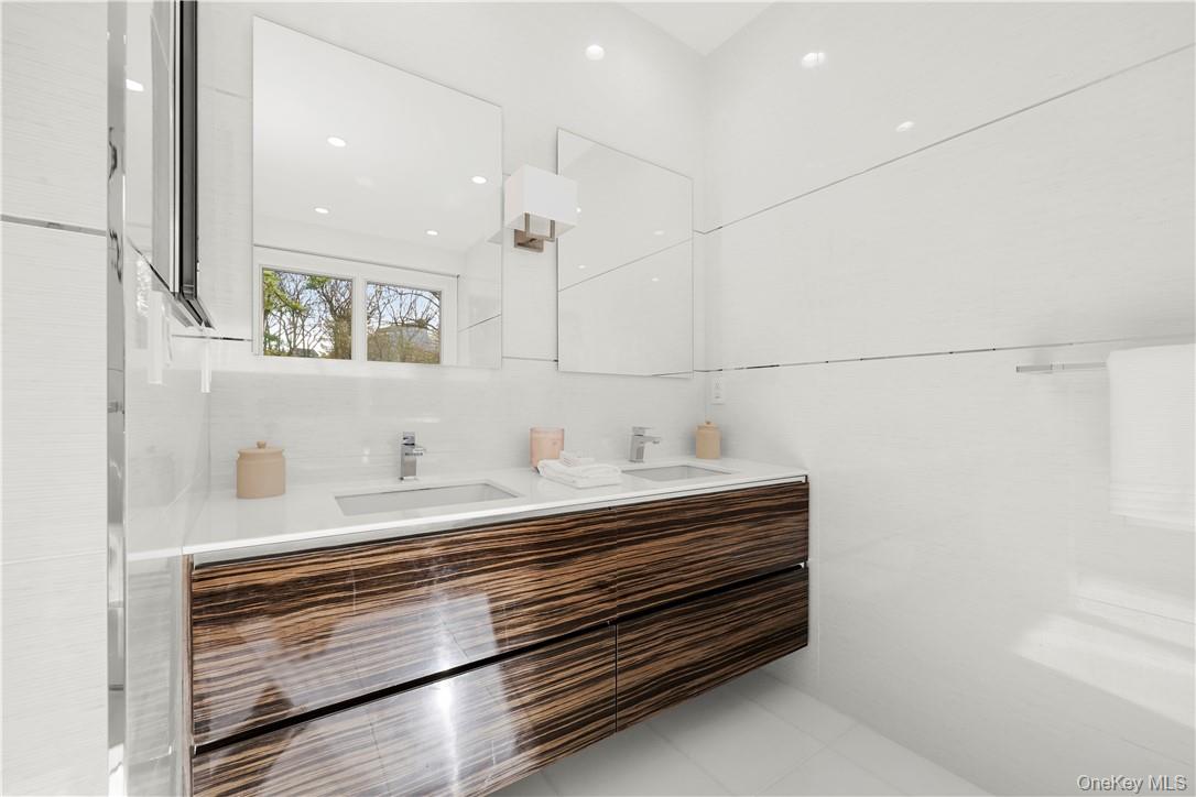 343 Purchase Street Rye, NY 10580 - Photo 28 of 36 a bathroom with a sink and a mirror