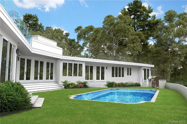 a view of a chairs and table in the back yard of the house