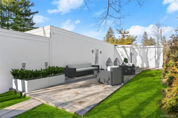 a view of a house with swimming pool and a yard