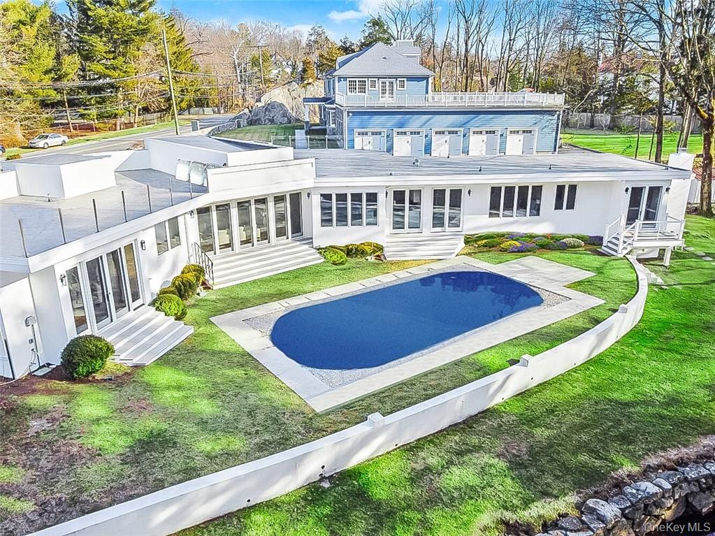 343 Purchase Street Rye, NY 10580 - Photo 33 of 36 a view of a house with swimming pool and a yard