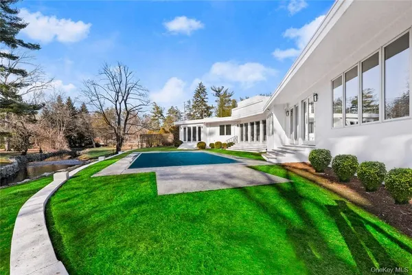 an aerial view of a house with a yard and a garden