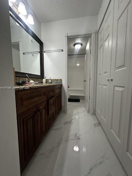 14952 Southwest 75th Terrace Miami, FL 33193 - Photo 13 of 16 a kitchen with stainless steel appliances a stove and a refrigerator