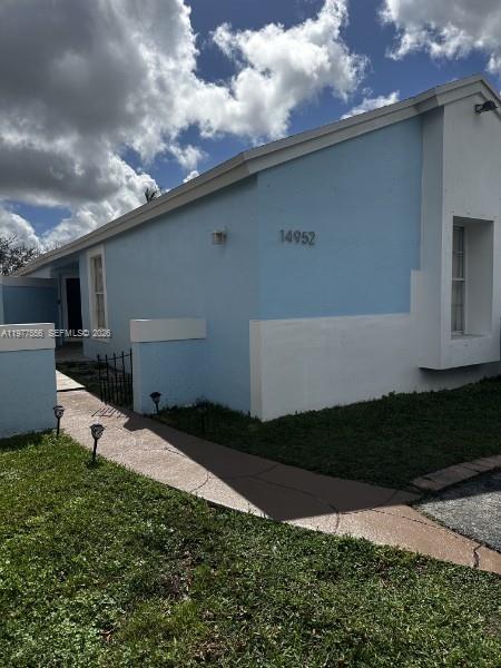14952 Southwest 75th Terrace Miami, FL 33193 - Photo 2 of 16 a backyard of a house with lots of green space