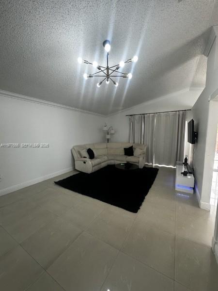 14952 Southwest 75th Terrace Miami, FL 33193 - Photo 5 of 16 a bed room with a bed and a lamp