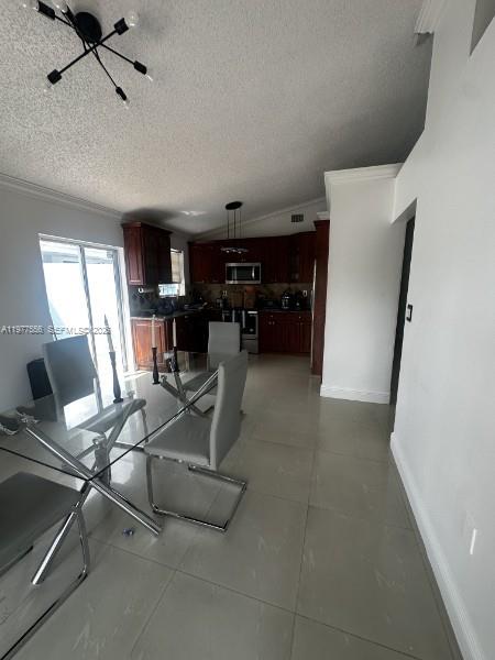 14952 Southwest 75th Terrace Miami, FL 33193 - Photo 8 of 16 a view of a livingroom with furniture and a window