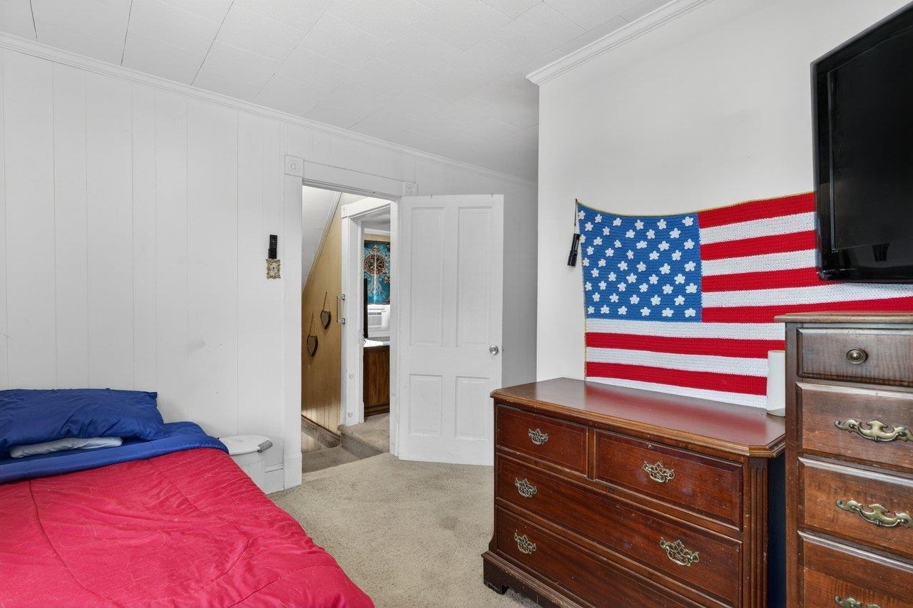 724 Newtown Road Elkton, VA 22827 - Photo 27 of 38 a bedroom with a bed and a television