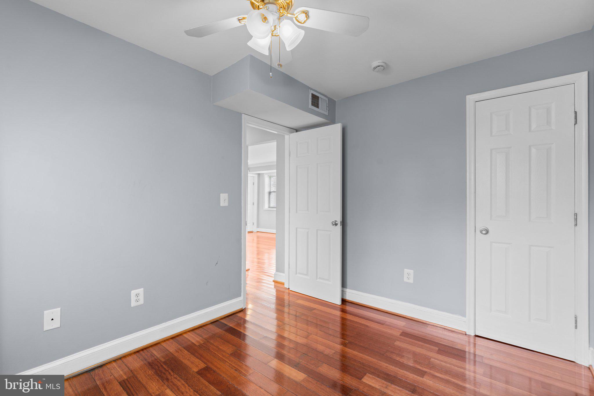 3866 9th Street Southeast, Unit 101 Washington, DC 20032 - Photo 15 of 24 a view of an empty room with wooden floor