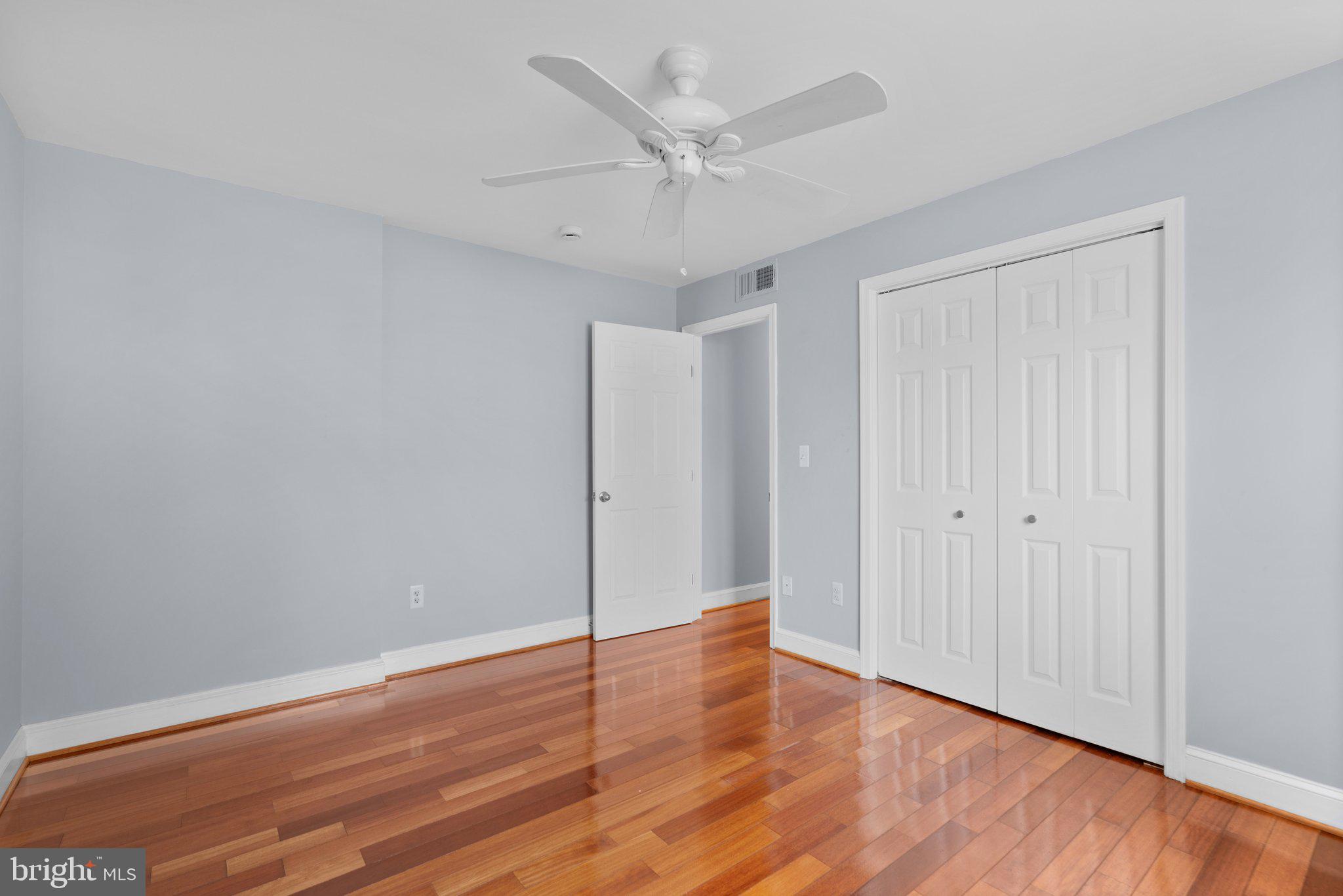 3866 9th Street Southeast, Unit 101 Washington, DC 20032 - Photo 21 of 24 a view of an empty room with wooden floor