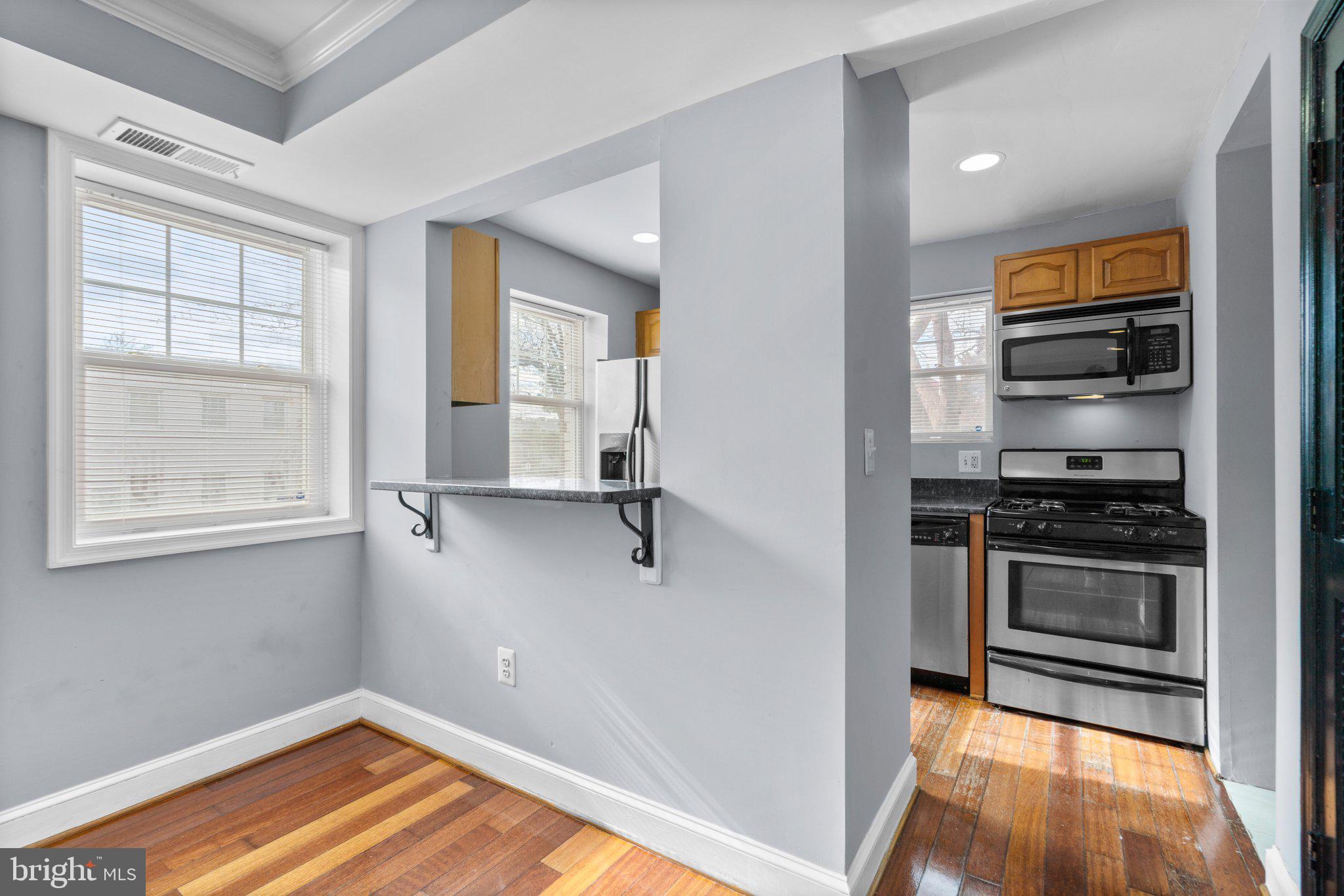 3866 9th Street Southeast, Unit 101 Washington, DC 20032 - Photo 7 of 24 a view of a kitchen from the hallway