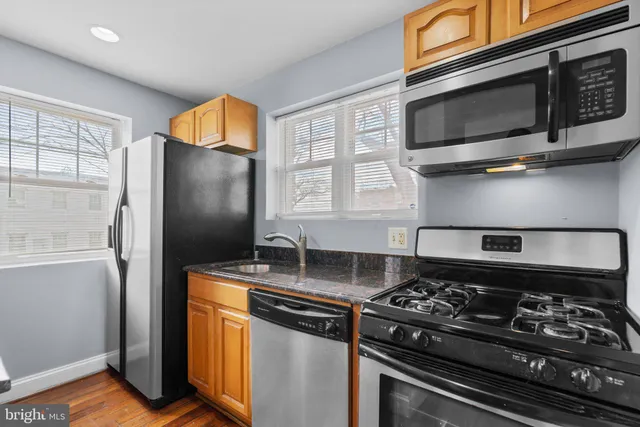 a kitchen with a stove and a microwave