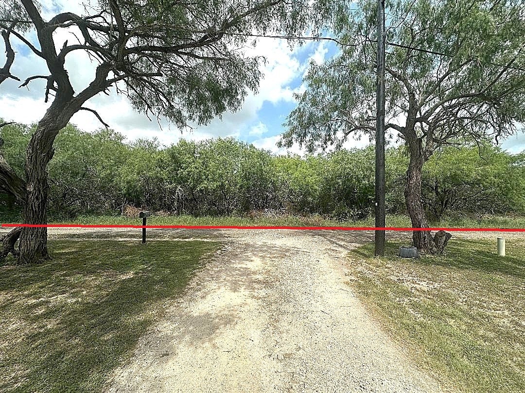 37658 Garza Road San Benito, TX 78586 - Photo 2 of 7 a view of a park with large trees