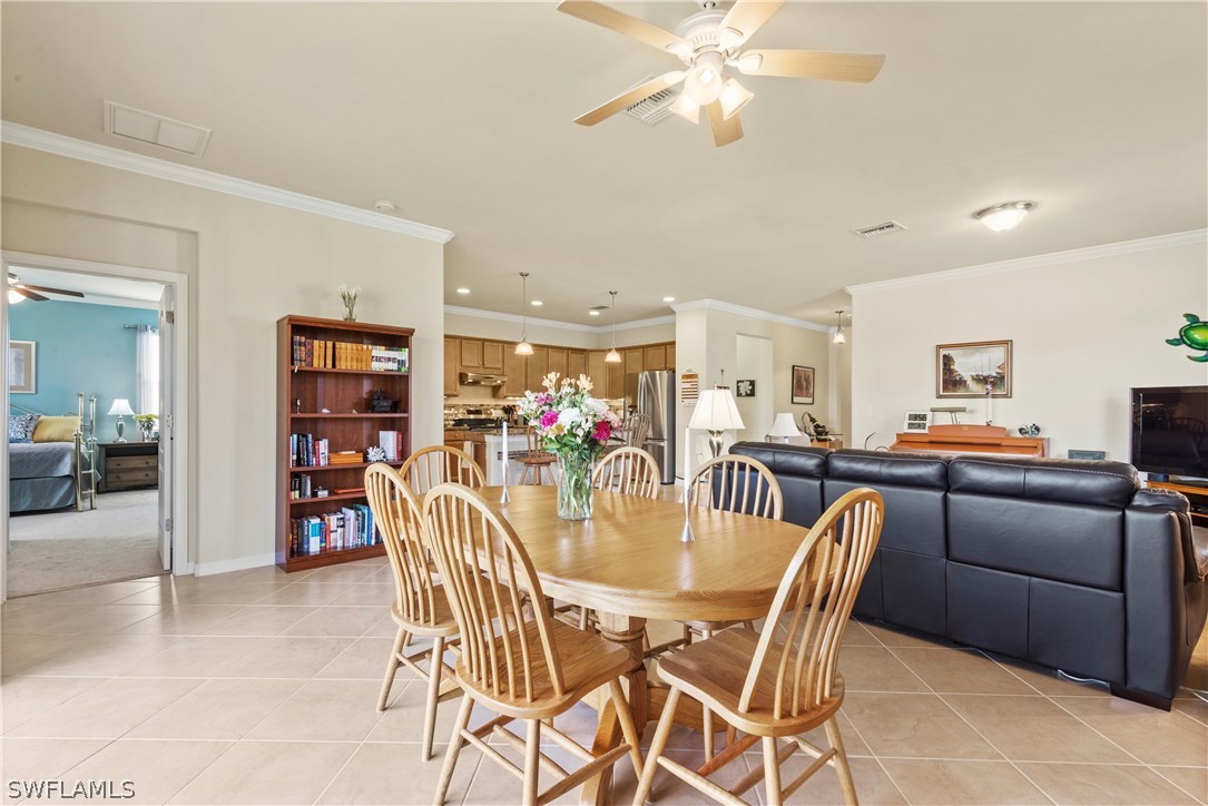 11680 Eros Road Lehigh Acres, FL 33971 - Photo 13 of 27 a dining room with furniture and window