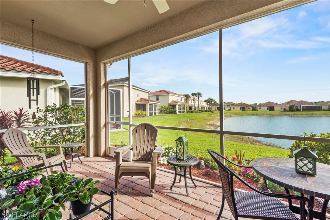 11680 Eros Road Lehigh Acres, FL 33971 - Photo 15 of 27 a view of a balcony with lake view and a potted plant