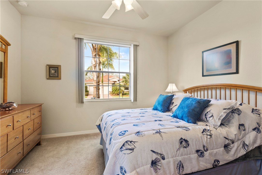 11680 Eros Road Lehigh Acres, FL 33971 - Photo 25 of 27 a bedroom with a bed and a window