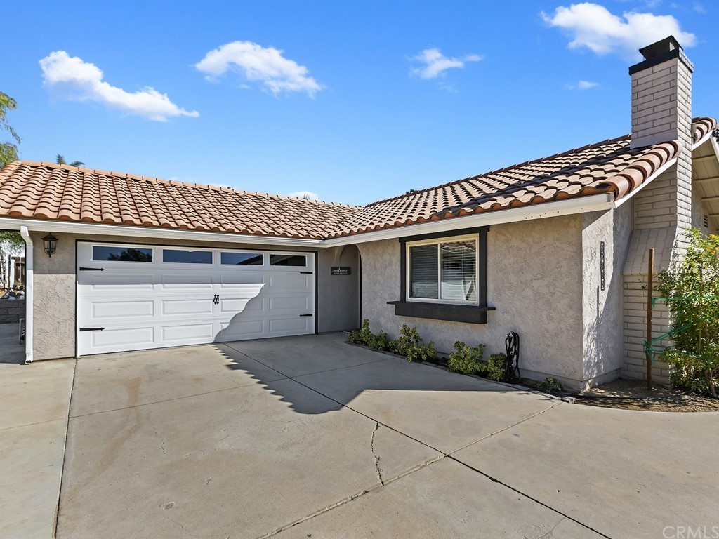 17188 Taft Street Riverside, CA 92508 - Photo 1 of 1 a front view of a house with garden