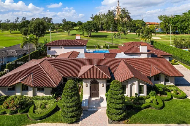 a aerial view of a house with garden space and street view