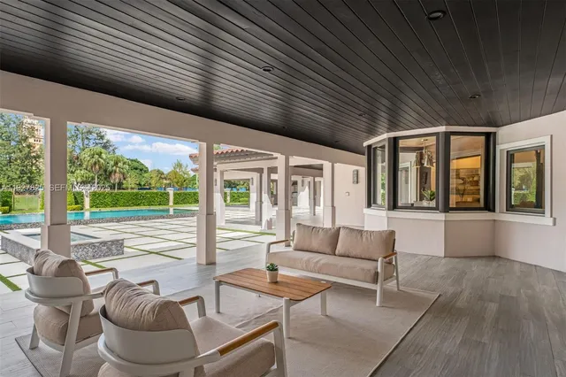 a bathroom with a double vanity sink mirror and bathtub