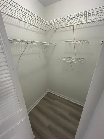 a view of a room with racks on the wall