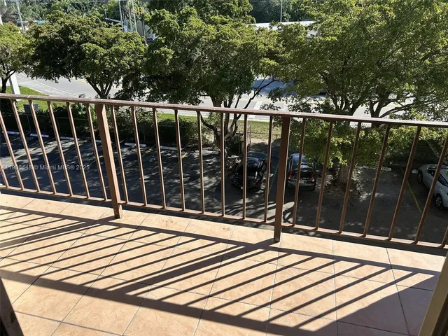 a view of a chairs and table in the patio