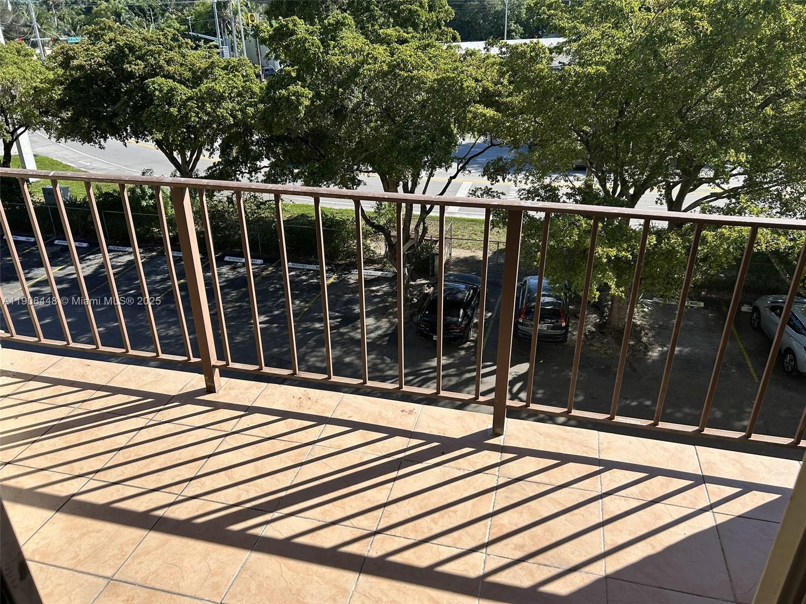 11905 Northeast 2nd Avenue, Unit C402 North Miami, FL 33161 - Photo 5 of 18 a view of a chairs and table in the patio