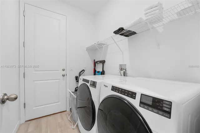 a utility room with dryer and washer