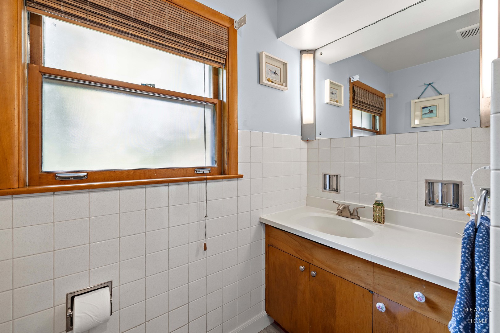 521 Skyline Drive Fox River Grove, IL 60021 - Photo 19 of 34 a bathroom with a sink a mirror and a window