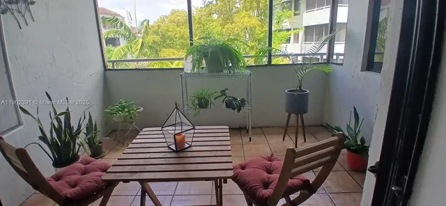 a view of outdoor dining space with furniture
