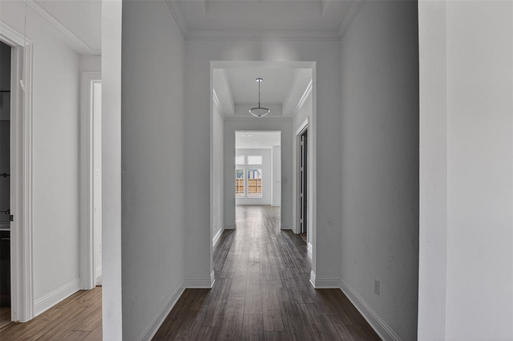 845 Ranchland Road Justin, TX 76247 - Photo 4 of 22 a view of a hallway with wooden floor