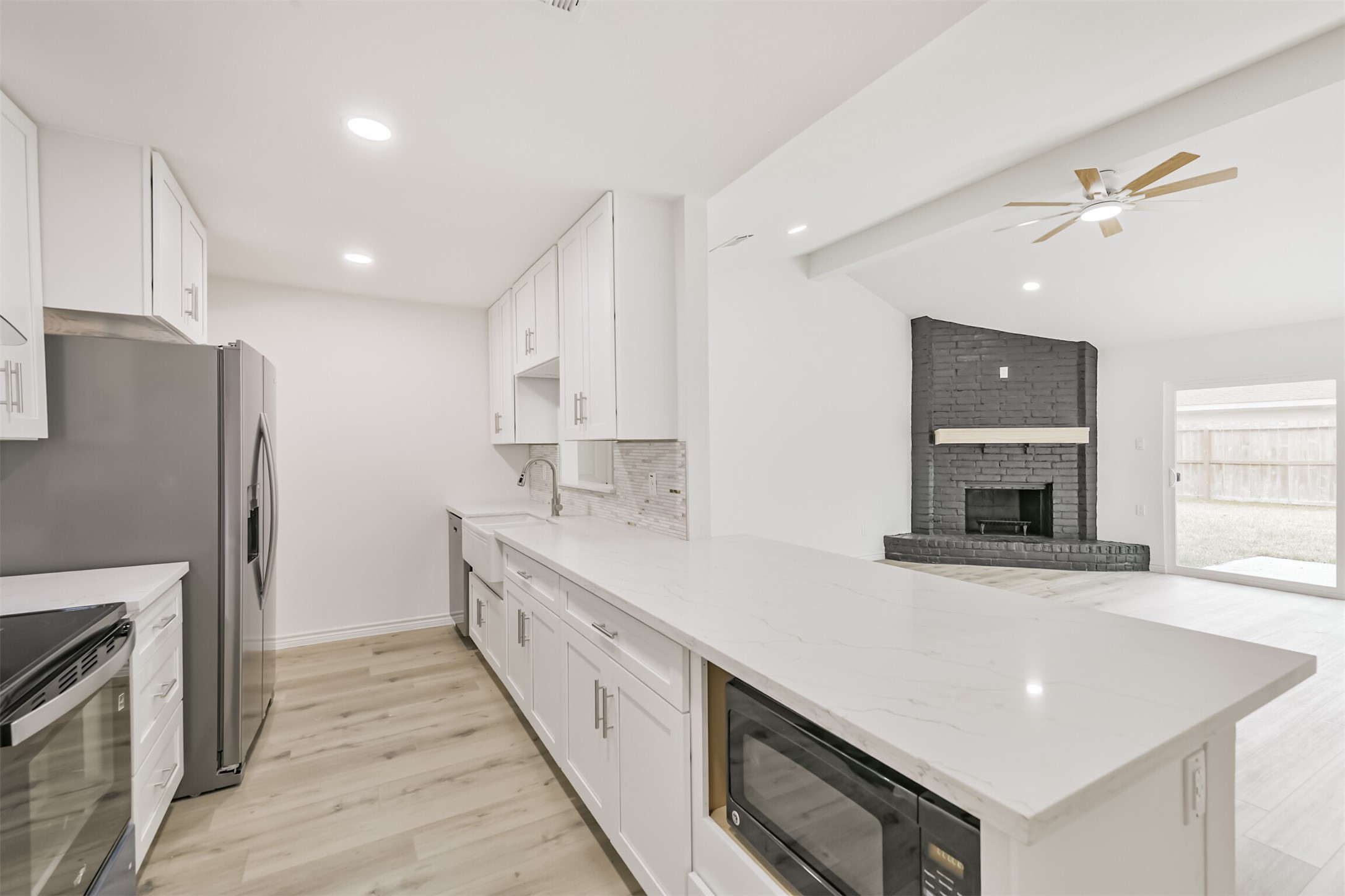 4215 Rosegate Drive Spring, TX 77373 - Photo 14 of 38 The kitchen offers ample storage space, with an extra deep cabinet added over the refrigerator.
