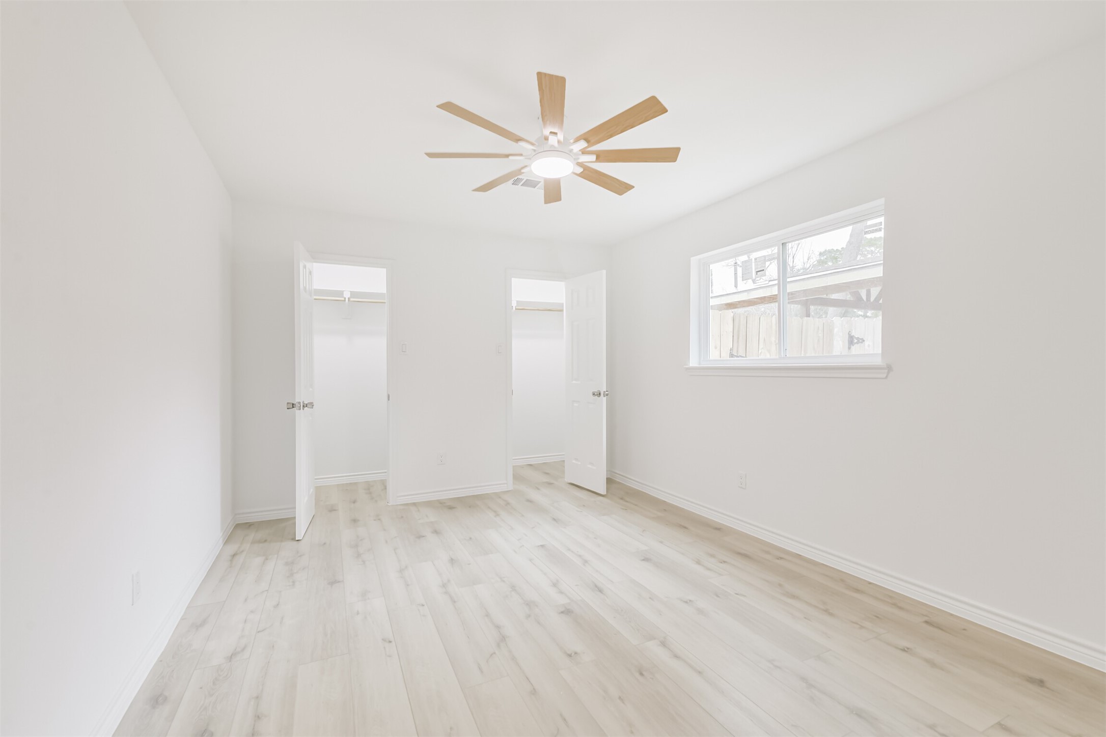 4215 Rosegate Drive Spring, TX 77373 - Photo 29 of 38 The third bedroom features a ceiling fan adjustable via remote control. The two closets also include updated, custom shelf brackets.