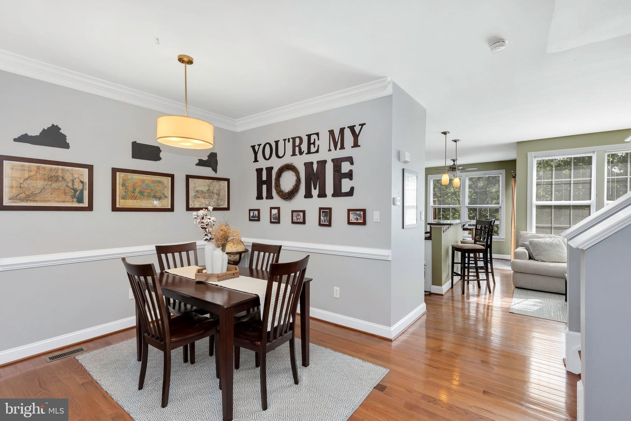 43173 Riders Square Ashburn, VA 20148 - Photo 6 of 35 Dining area with chair rail and crown molding