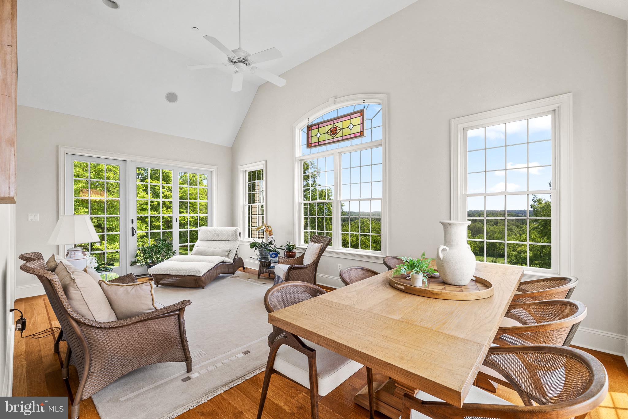 5835 Ridgeview Drive Doylestown, PA 18902 - Photo 20 of 63 a dining room with furniture a large window and potted plants