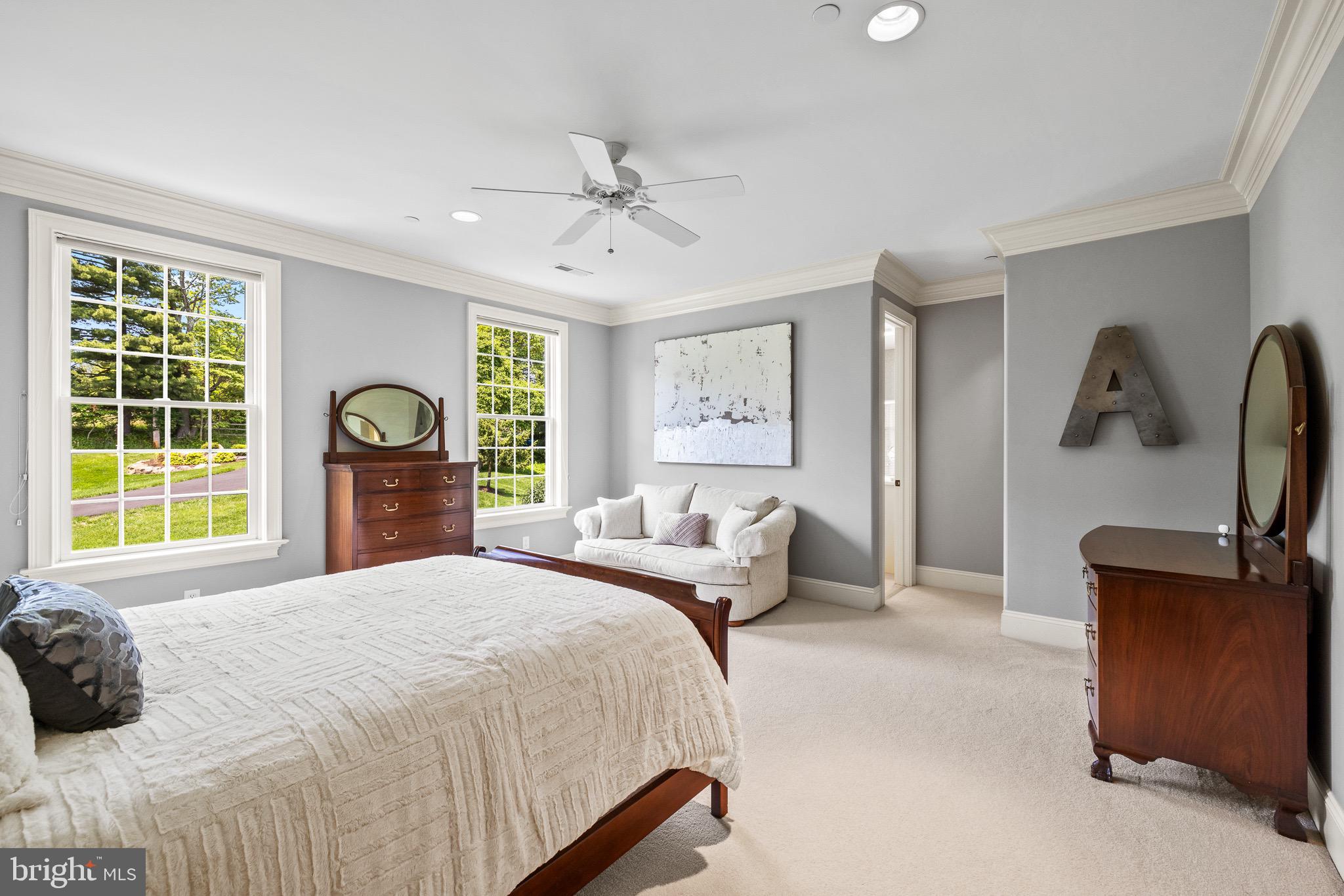 5835 Ridgeview Drive Doylestown, PA 18902 - Photo 32 of 63 a bedroom with a bed flat screen tv and windows