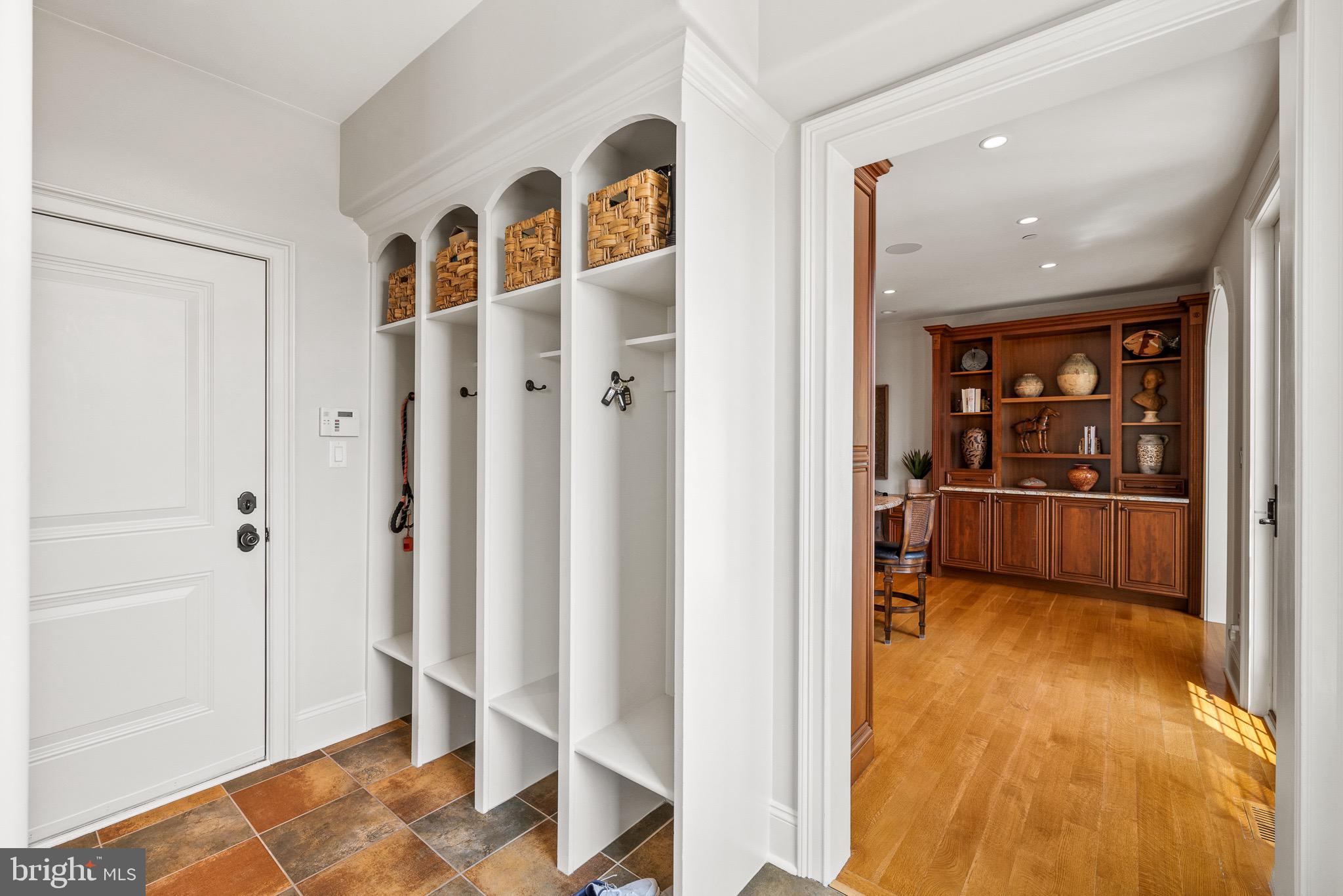 5835 Ridgeview Drive Doylestown, PA 18902 - Photo 34 of 63 a view of a hallway with wooden floor and workspace
