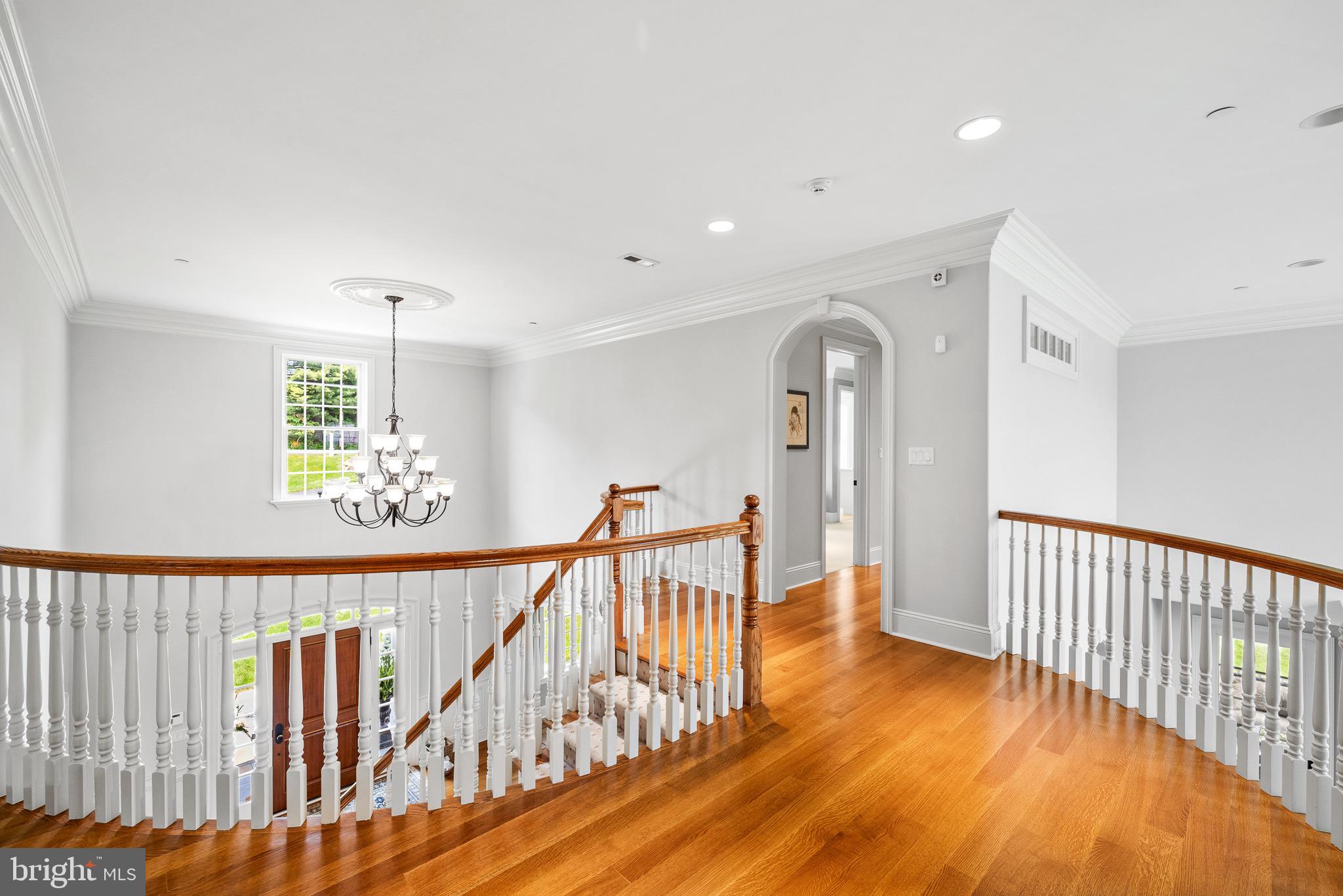 5835 Ridgeview Drive Doylestown, PA 18902 - Photo 35 of 63 a view of a hallway with wooden floor and windows