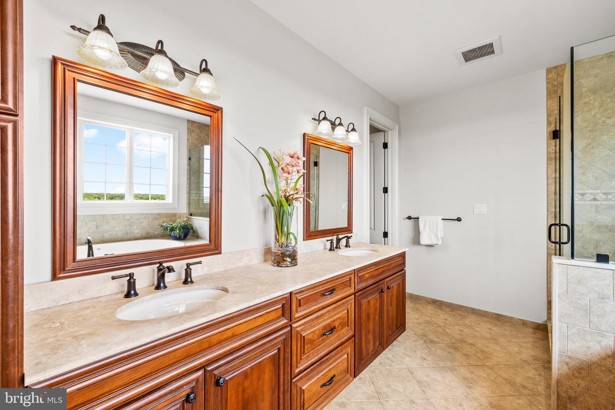 5835 Ridgeview Drive Doylestown, PA 18902 - Photo 43 of 63 a bathroom with a sink double vanity and a mirror