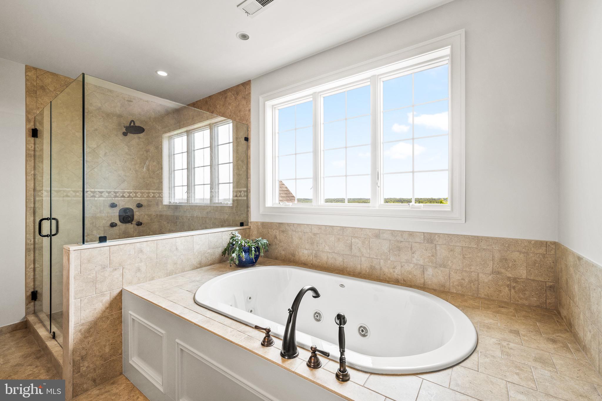 5835 Ridgeview Drive Doylestown, PA 18902 - Photo 45 of 63 a bathroom with a tub a sink and a window