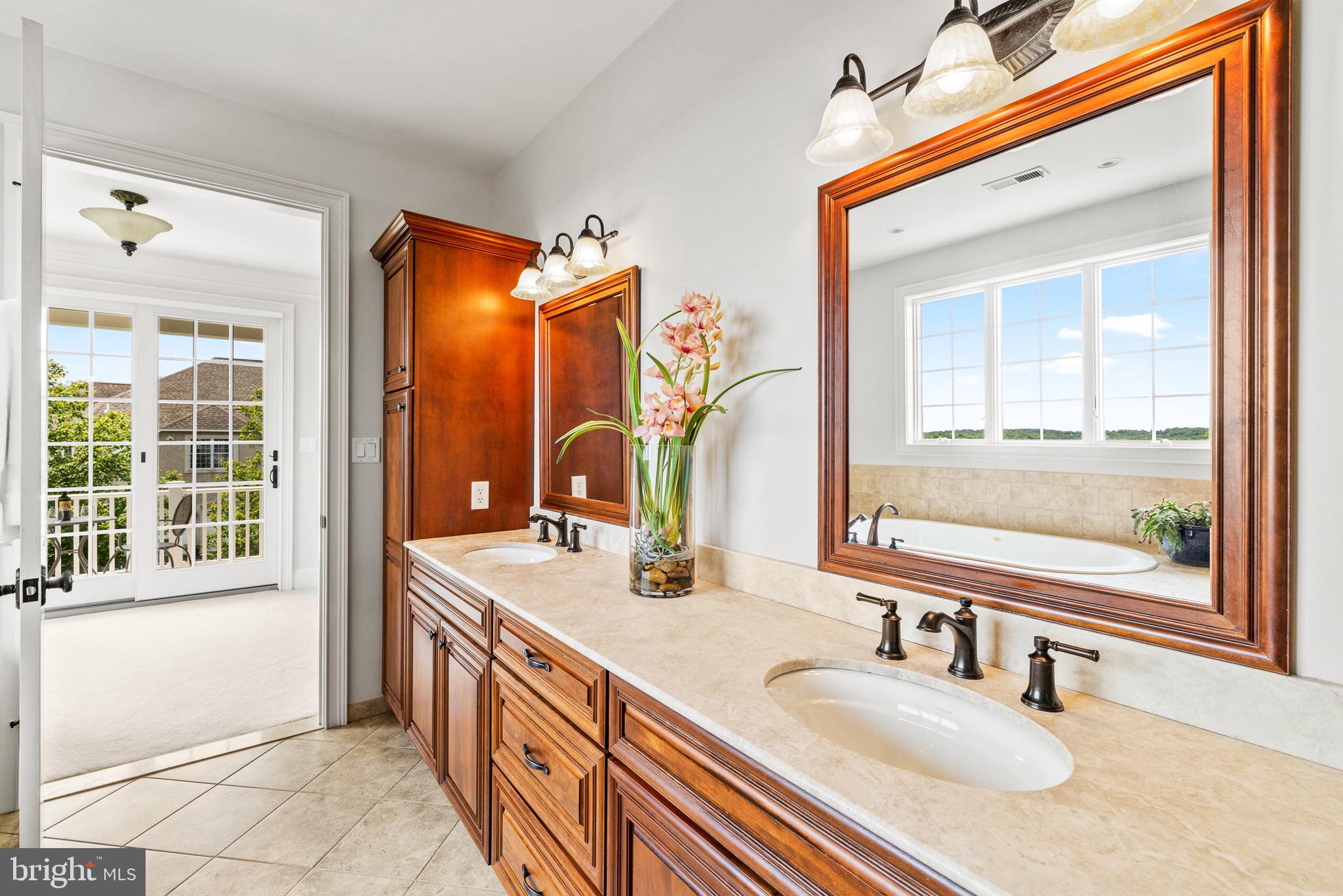 5835 Ridgeview Drive Doylestown, PA 18902 - Photo 46 of 63 a bathroom with a sink double vanity and a mirror