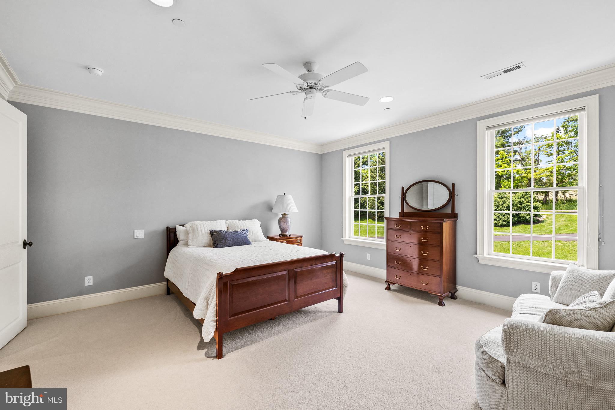 5835 Ridgeview Drive Doylestown, PA 18902 - Photo 49 of 63 a spacious bedroom with a bed and a chair
