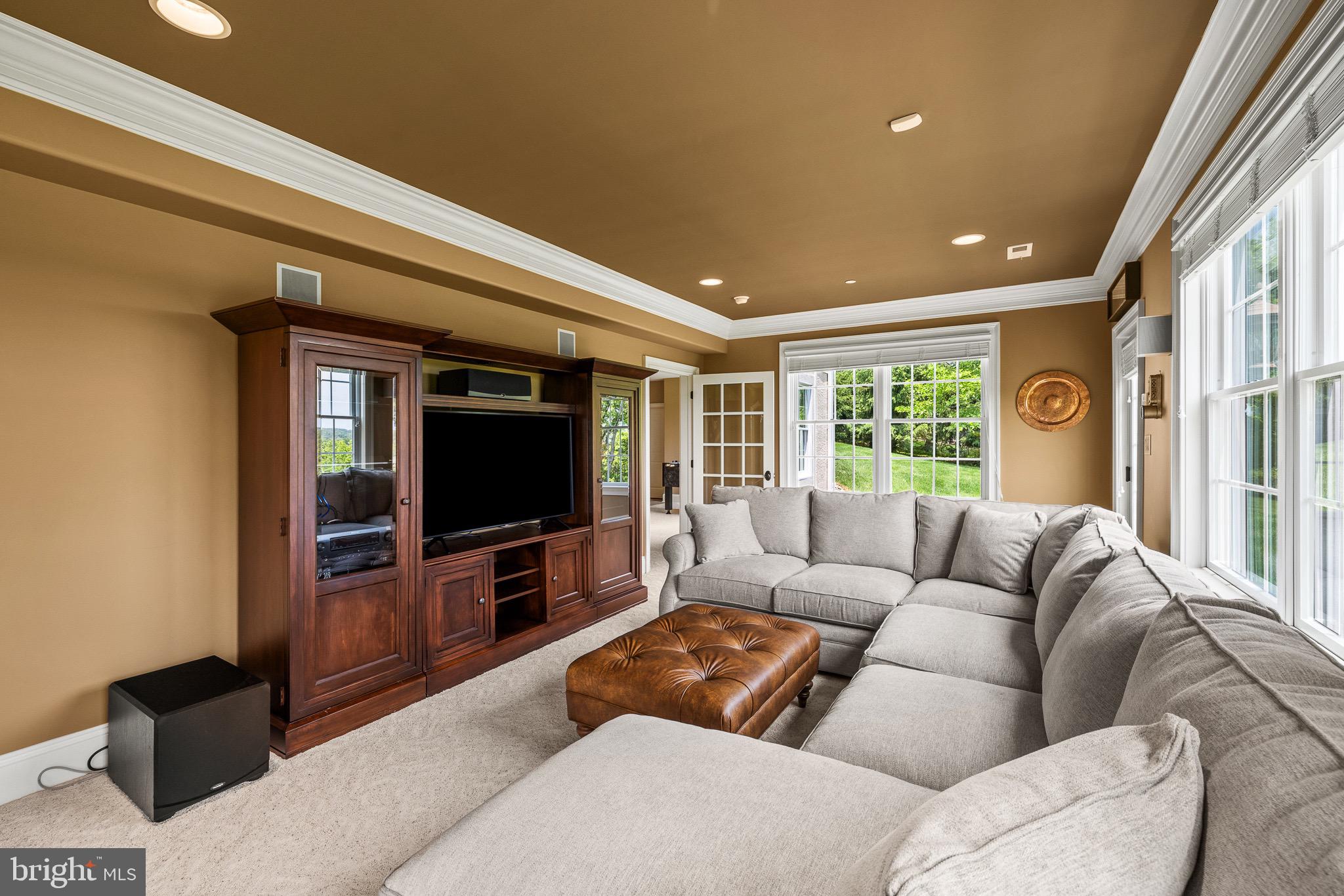 5835 Ridgeview Drive Doylestown, PA 18902 - Photo 54 of 63 a living room with furniture and a flat screen tv
