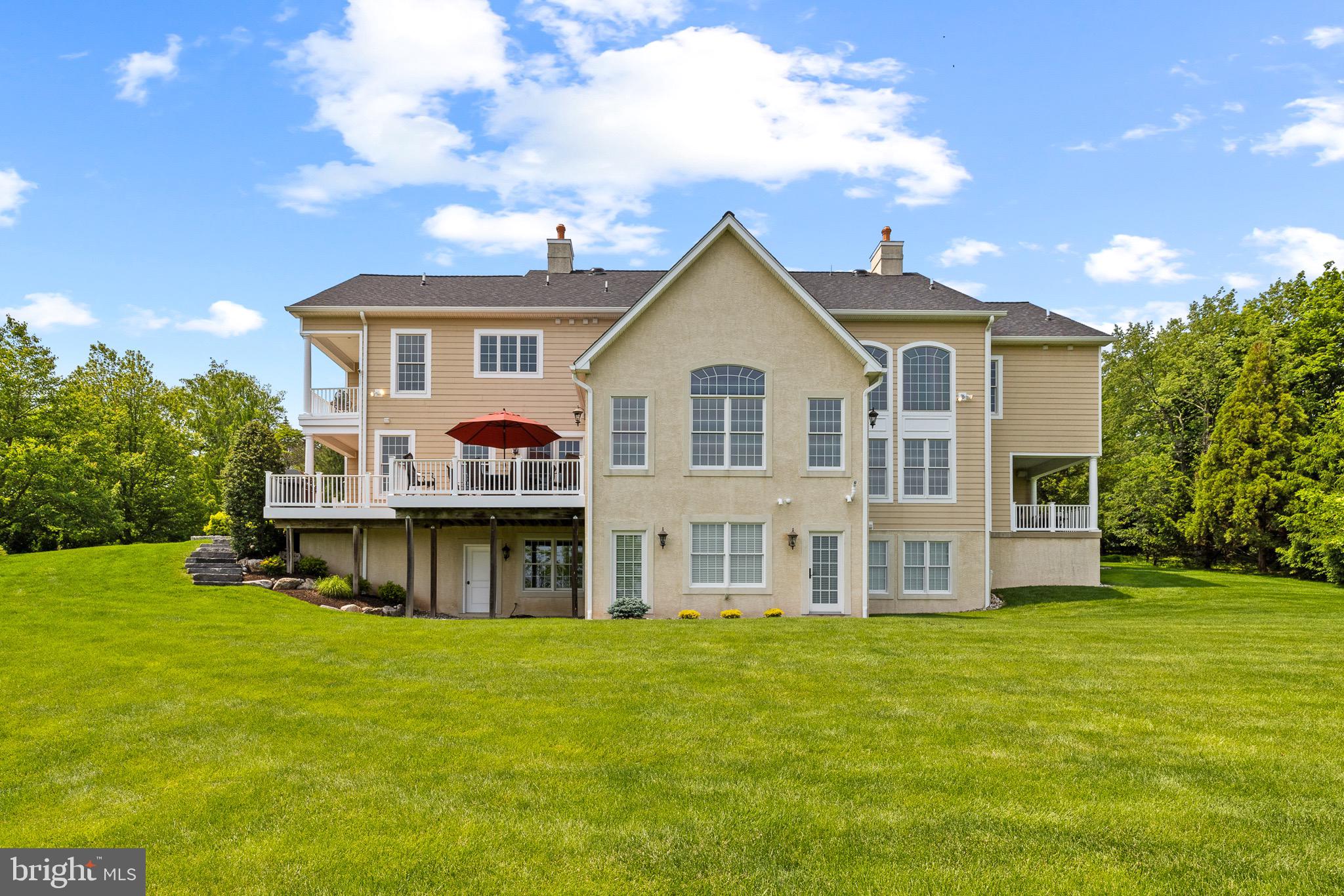 5835 Ridgeview Drive Doylestown, PA 18902 - Photo 57 of 63 a front view of a house with a garden and yard