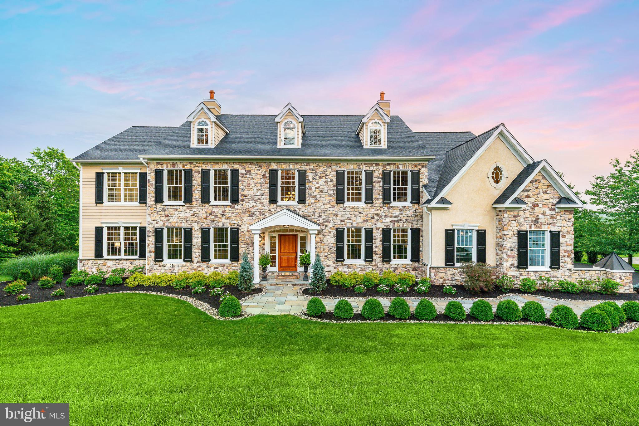 5835 Ridgeview Drive Doylestown, PA 18902 - Photo 61 of 63 a front view of a house with a yard and potted plants