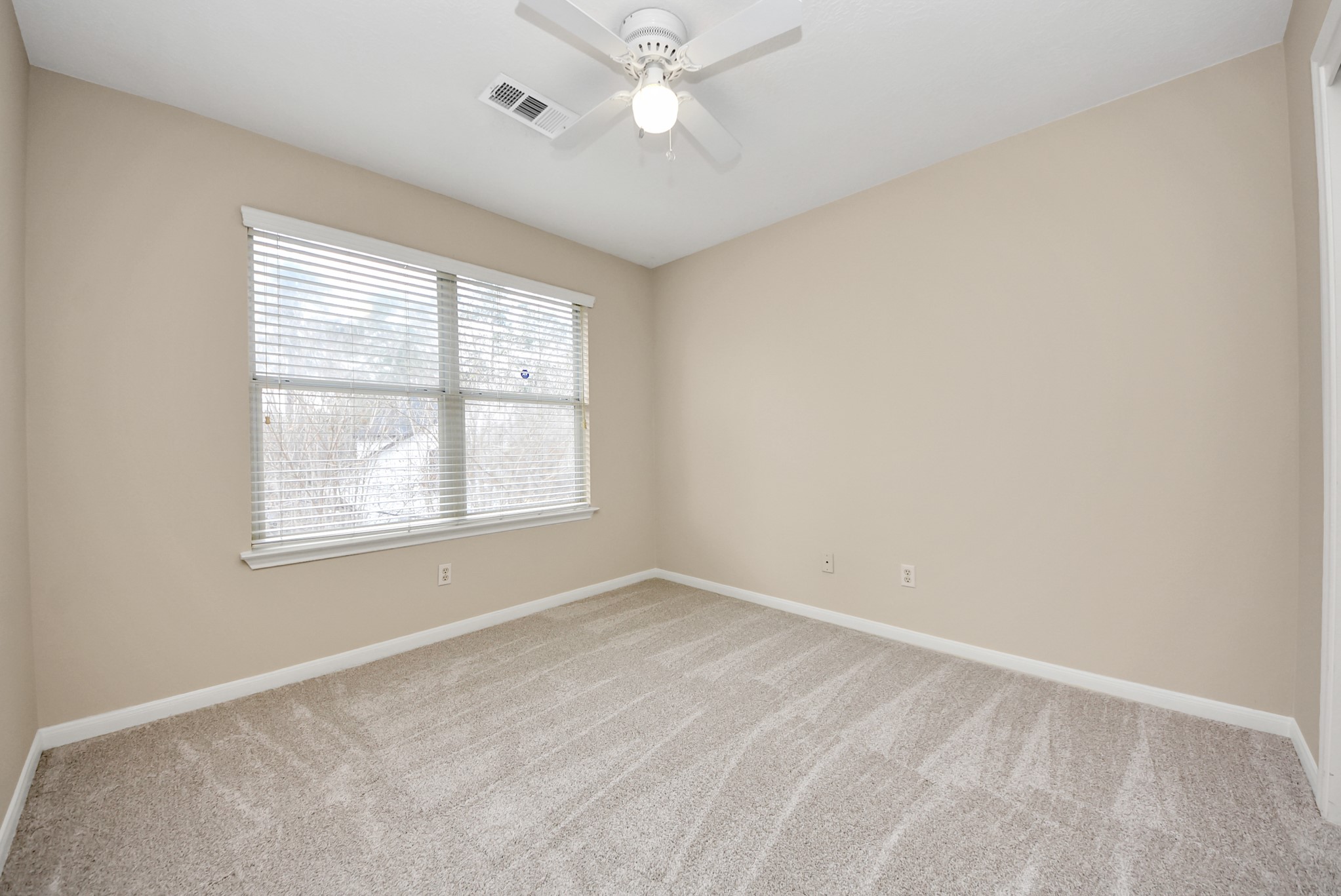 18963 Candlelight Crescent Road Spring, TX 77388 - Photo 30 of 33 Comfortable bedroom with large window that brings in abundant natural light.