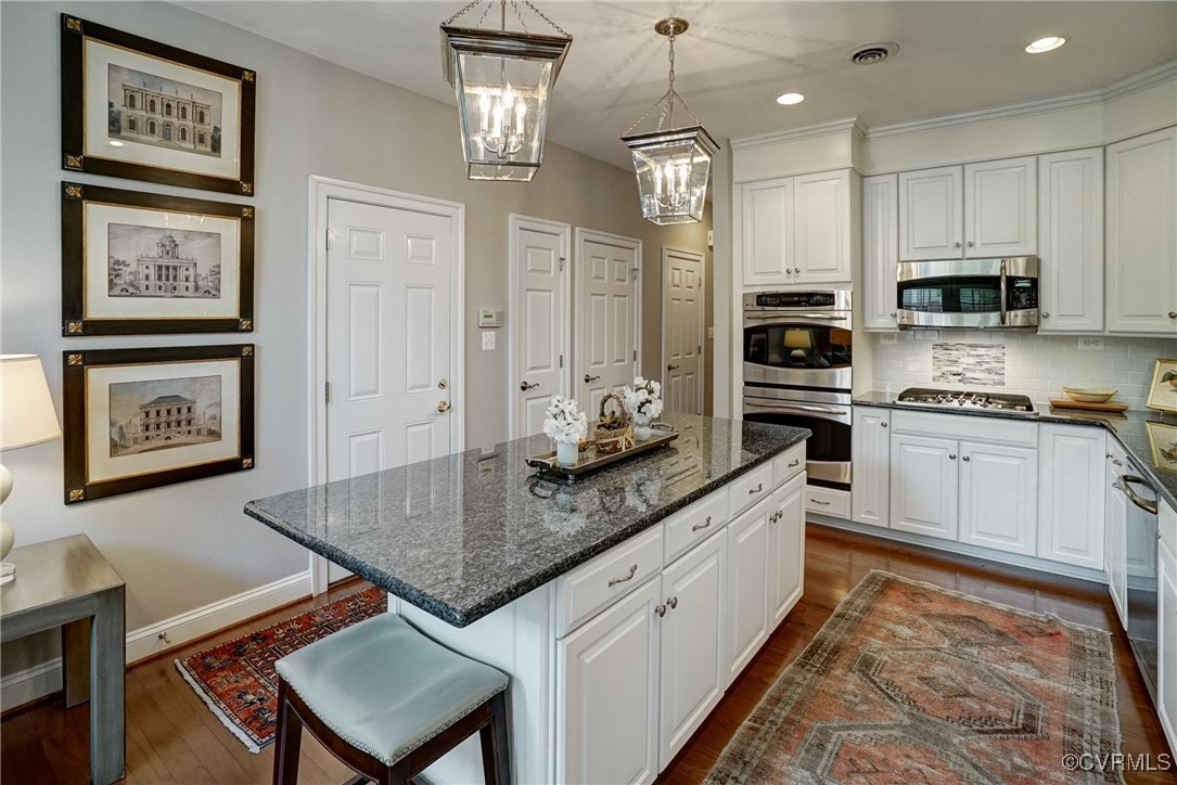 709 Chiswick Park Road Henrico, VA 23229 - Photo 17 of 47 Kitchen with white cabinets, a chandelier, applian