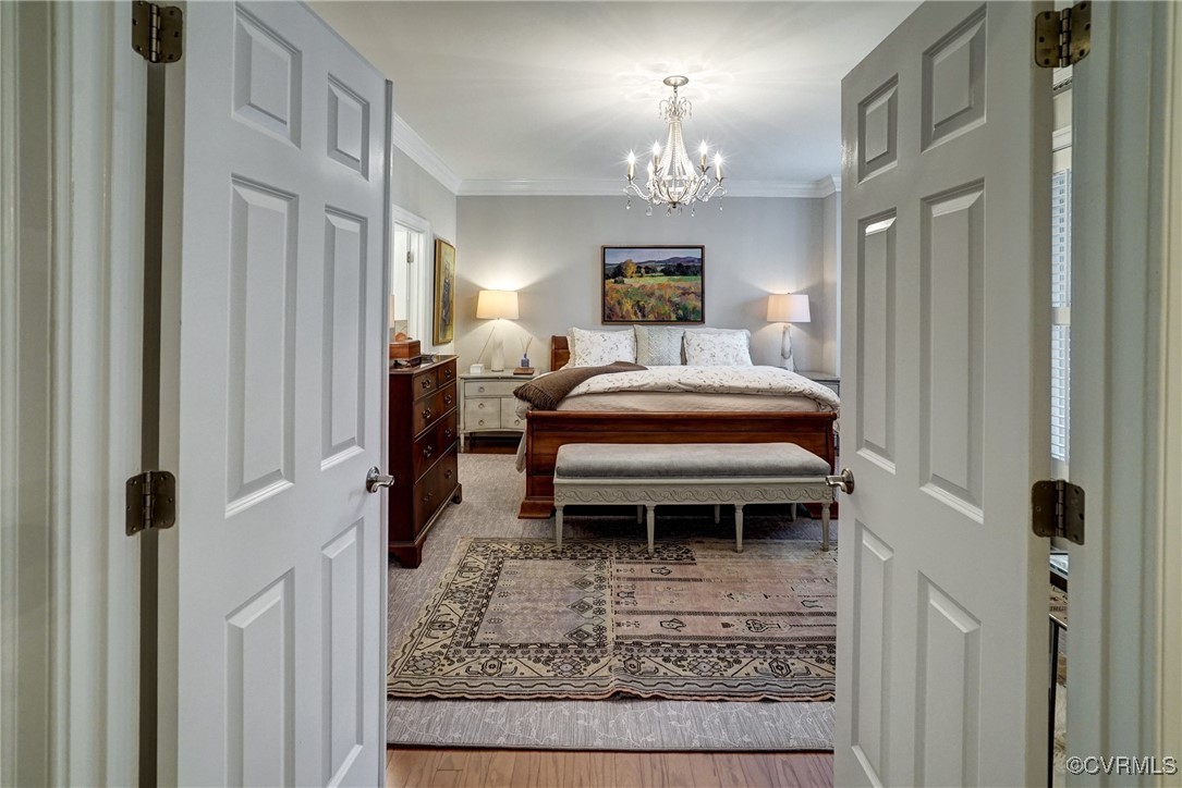 709 Chiswick Park Road Henrico, VA 23229 - Photo 23 of 47 Bedroom with a chandelier, ornamental molding, and