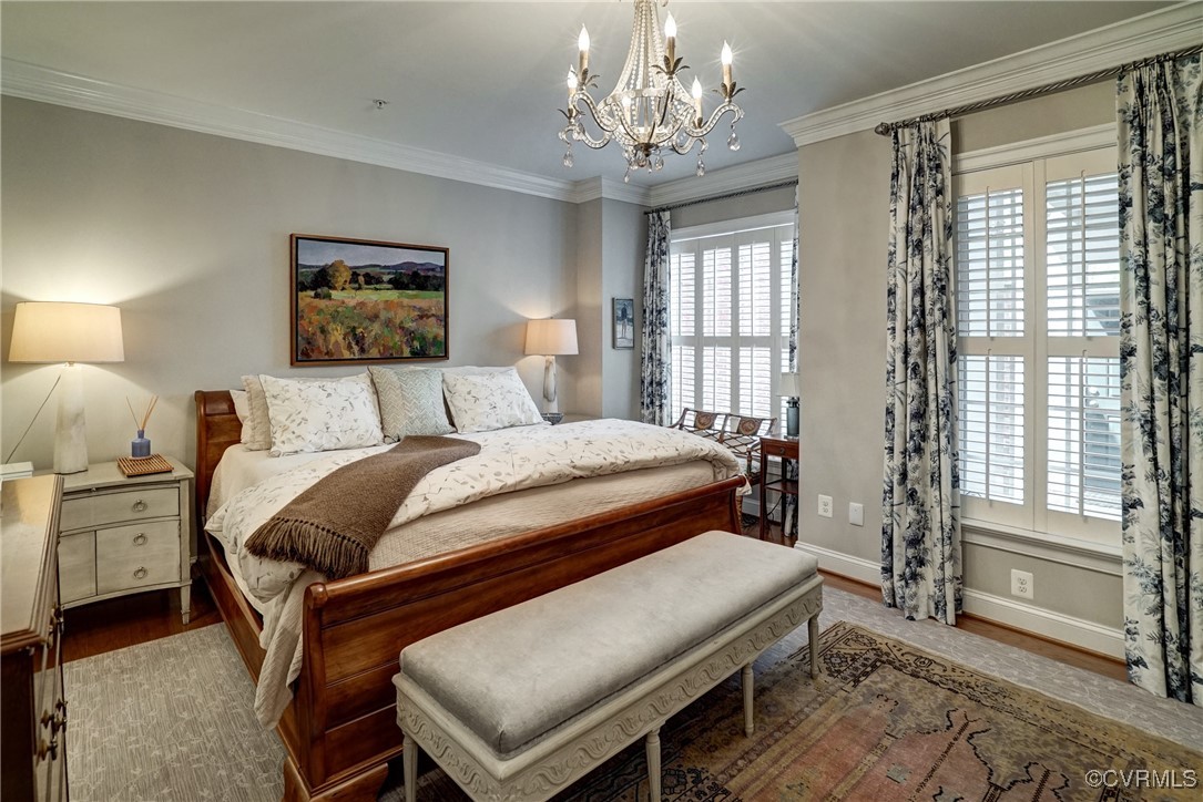 709 Chiswick Park Road Henrico, VA 23229 - Photo 24 of 47 Bedroom featuring wood finished floors, a chandeli