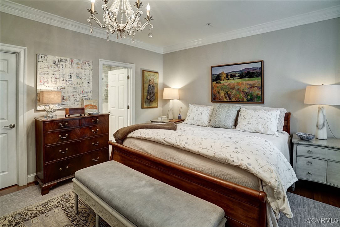 709 Chiswick Park Road Henrico, VA 23229 - Photo 25 of 47 Bedroom featuring a chandelier, wood finished floo