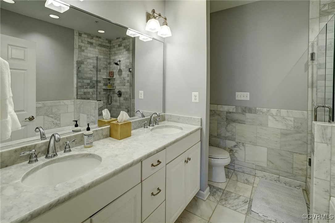 709 Chiswick Park Road Henrico, VA 23229 - Photo 26 of 47 Bathroom with a stall shower, double vanity, marbl